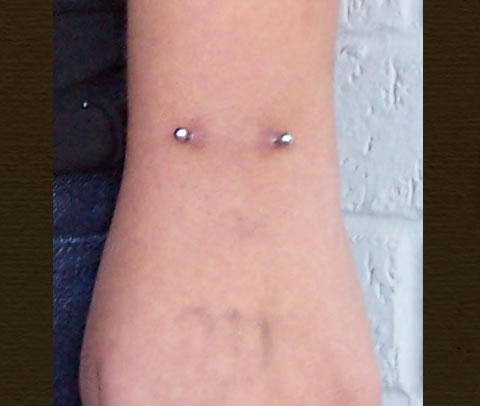 Liquid Courage Piercing Gallery: Surface Piercing